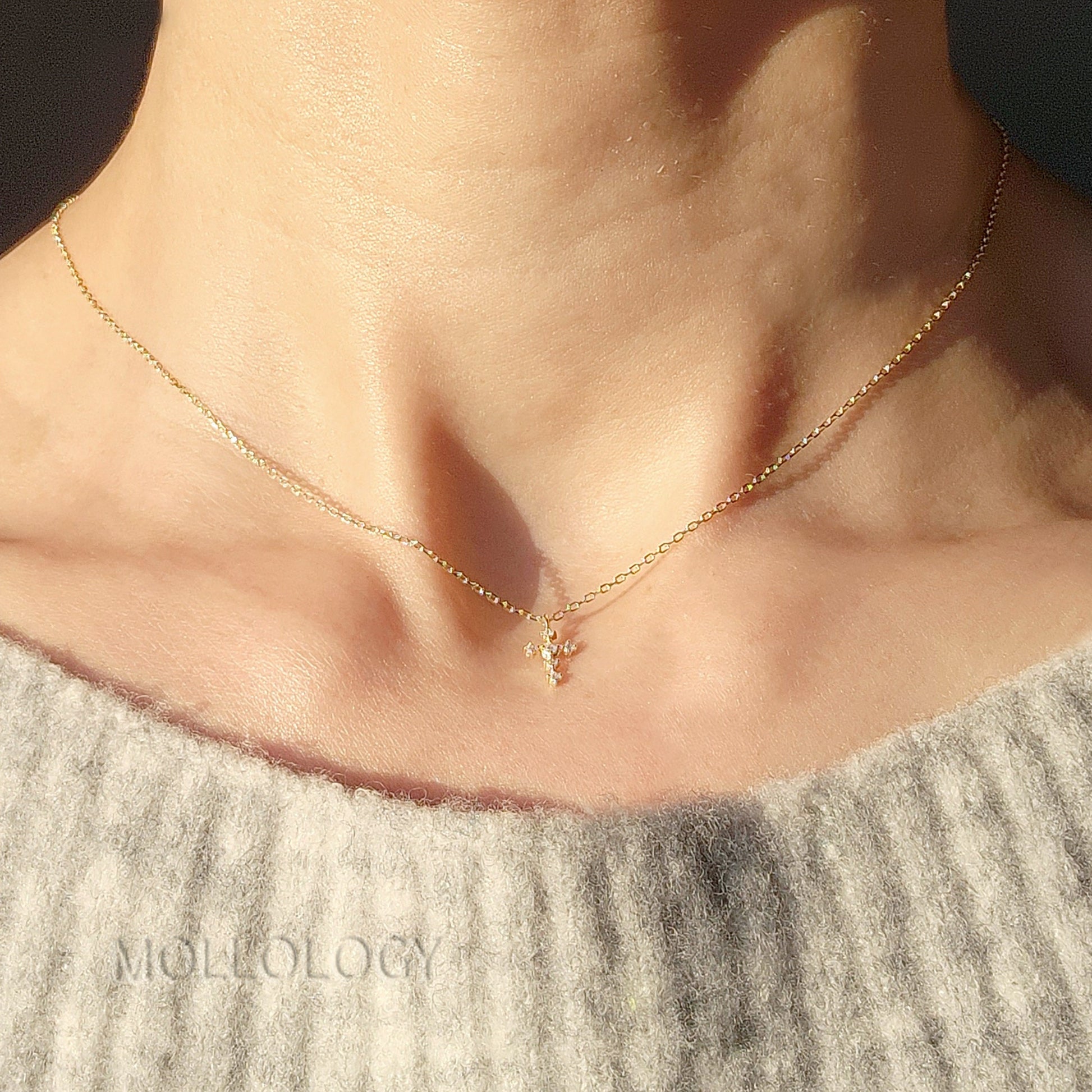 These dainty cross necklaces are a perfect blend of faith and elegance. Handcrafted with care, they feature a delicate pave cubic zirconia cross, making them an ideal gift for birthdays, anniversaries, holidays, or any special occasion. Tiny, minimalist, and timeless, they layer beautifully or stand alone.